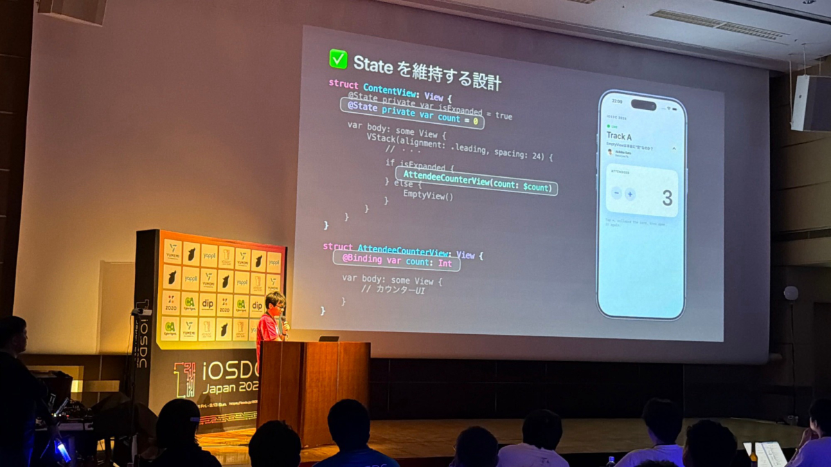 EmptyViewとStateの設計についてのスライドの前で登壇するAkihiko Satoさん
